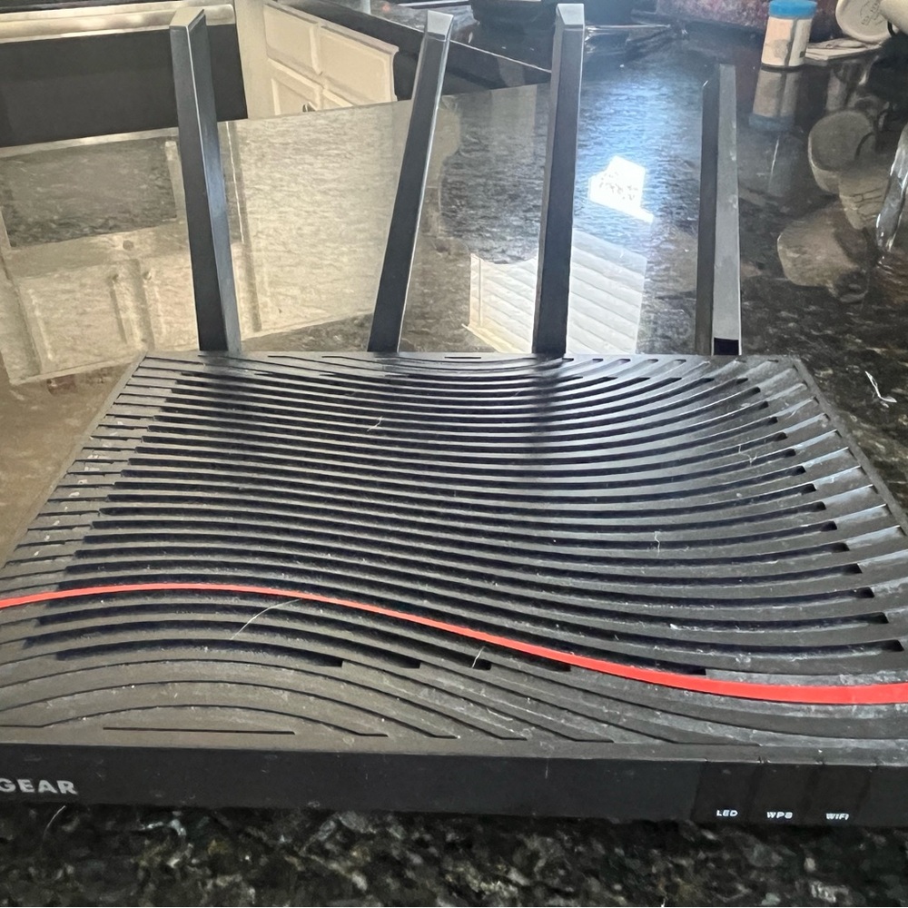 Netgear Black Wireless Router with Ribbed Design and LED Indicators - Picture 2 of 3